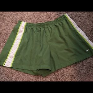 Lime green Nike shorts with white stripe